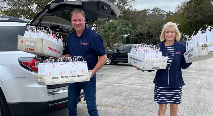 An Image of Elections staff with trays of Mobile Voter Program (MVP) bags